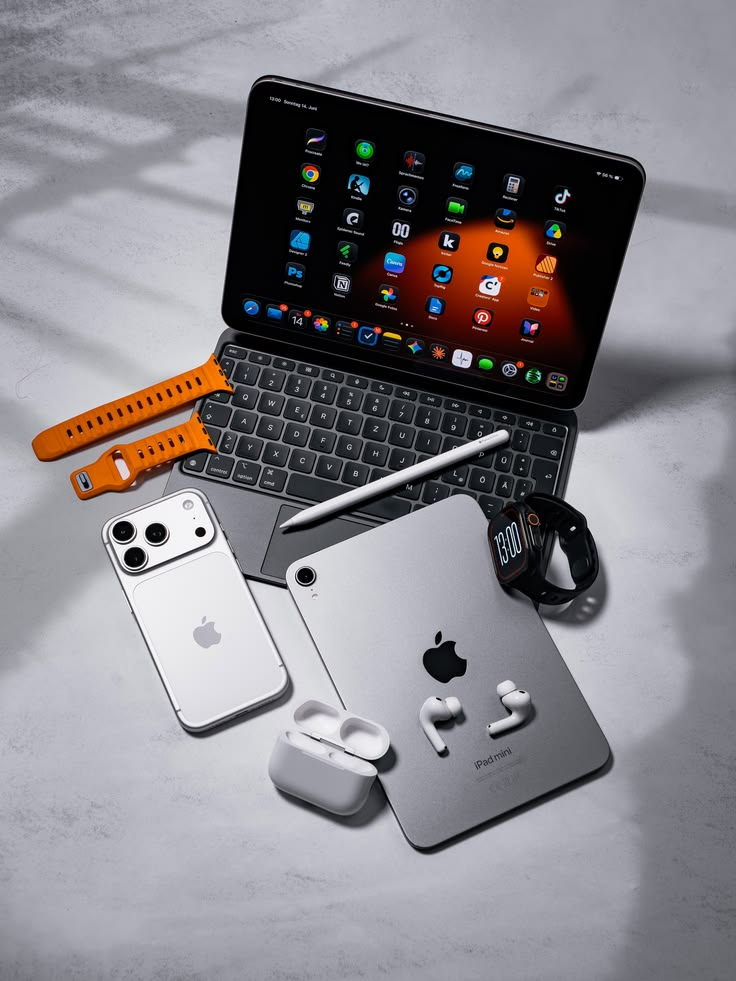 iPad mini with AirPods and Apple Watch bands